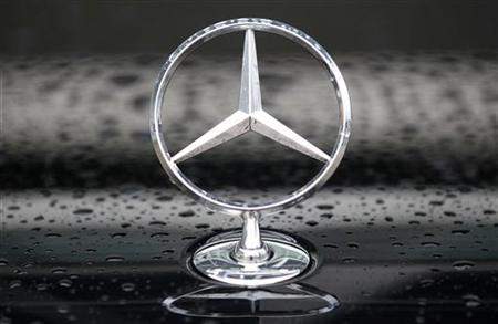The Mercedes logo is displayed on a limousine car parked outside the European Commission headquarters in Brussels